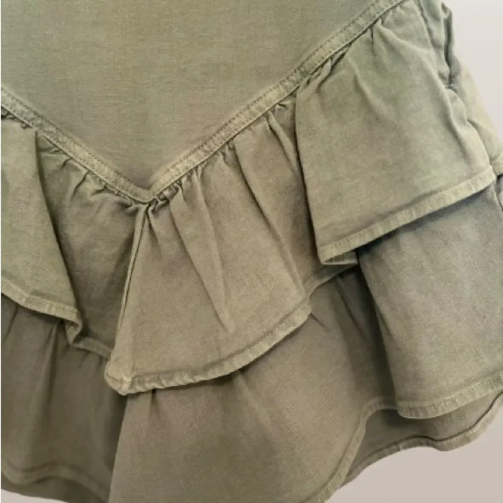 MOTHER Ruffled Mini Skirt in Loden Frost